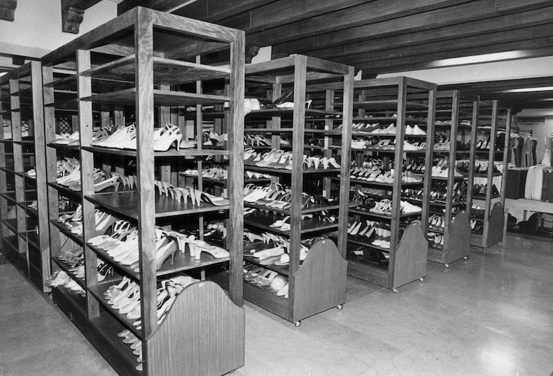 FILE - Shoes belonging to Philippine former first lady Imelda Marcos are seen lined up on shelves in the basement of the Malacanang Palace in Manila in this March 11, 1986 file photo. Termites, storms and neglect have damaged part of former Philippine fir