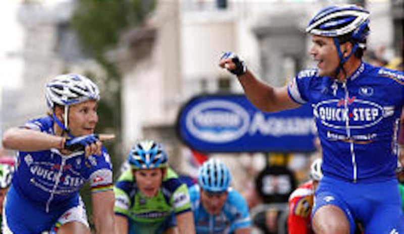 Belgium's Tom Boonen, left, celebrates as he crosses the finish line with his teammate and countryman Gert Steegmans after the second stage of the Tour de France.