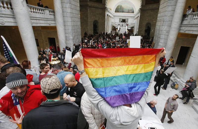 Plaintiffs, activists and equality supporters rally at the Utah State Capitol in Salt Lake City Friday, Jan. 10, 2014.