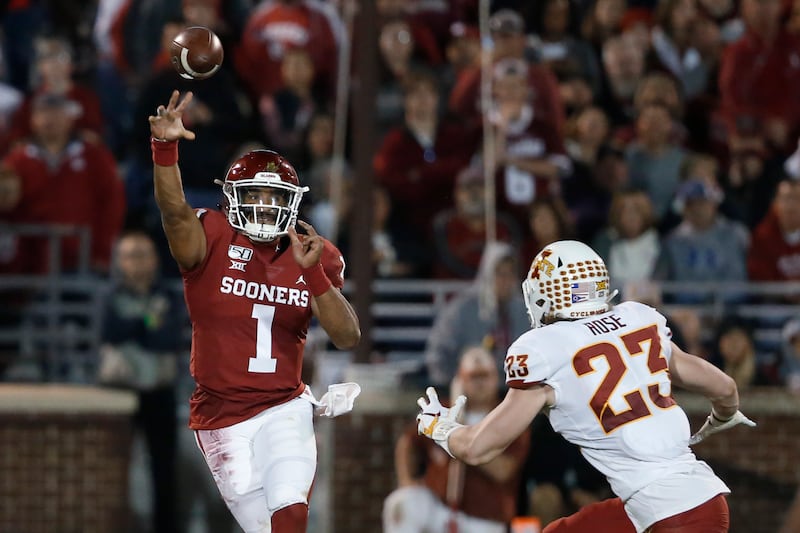 Oklahoma quarterback Jalen Hurts (1) throws under pressure from Iowa State linebacker Mike Rose (23) during the first quarter of an NCAA college football game in Norman, Okla., Saturday, Nov. 9, 2019.