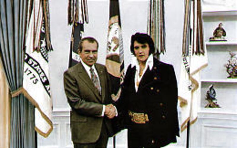 President Richard Nixon shakes hands with Elvis Presley on Dec. 21, 1970, during their half-hour meeting in the Oval Office. An exhibit featuring relics from the meeting is on display in the Richard Nixon Presidential Library \& Birthplace in Yorba Linda.