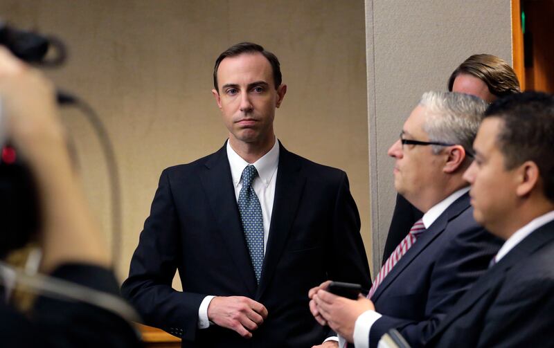 FILE - In this Feb. 7, 2019 file photo, Secretary of State David Whitley, left, arrives for his confirmation hearing in Austin, Texas. Whitley, Texas’ embattled elections chief, is on the brink of losing his job over wrongly questioning the U.S. citizensh