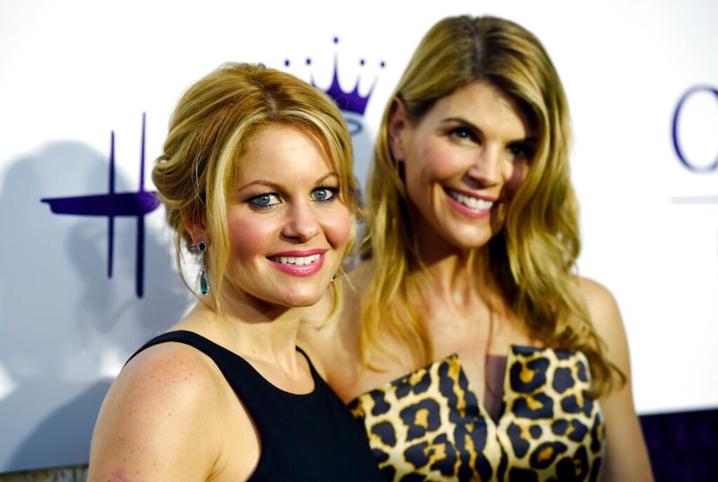 Candace Cameron Bure and Lori Loughlin pose together at the Crown Media Family Networks Television Critics Association party.