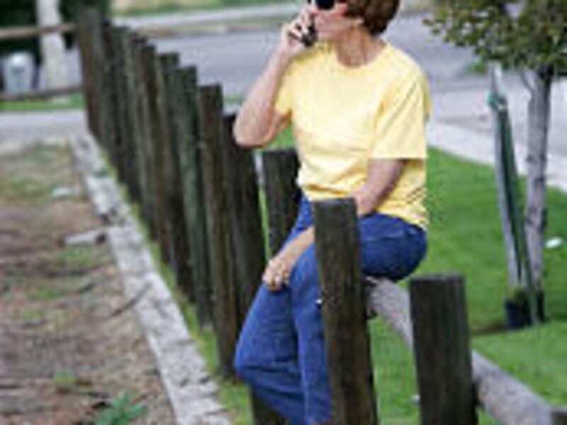 Salt Lake County Mayor Nancy Workman talks on the phone before a horse ride on which she was made aware of a recommendation she be charged with felonies.