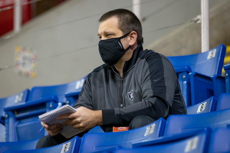 A scout for the Las Vegas Raiders watches Central Arkansas play North Dakota State at an NCAA college football game Saturday, Oct. 3, 2020, in Fargo, N.D. North Dakota State won 39-28.