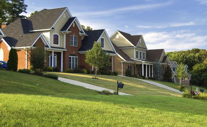 U.S. long-term mortgage rates declined this week following the Federal Reserve's decision to keep interest rates at record lows for now.