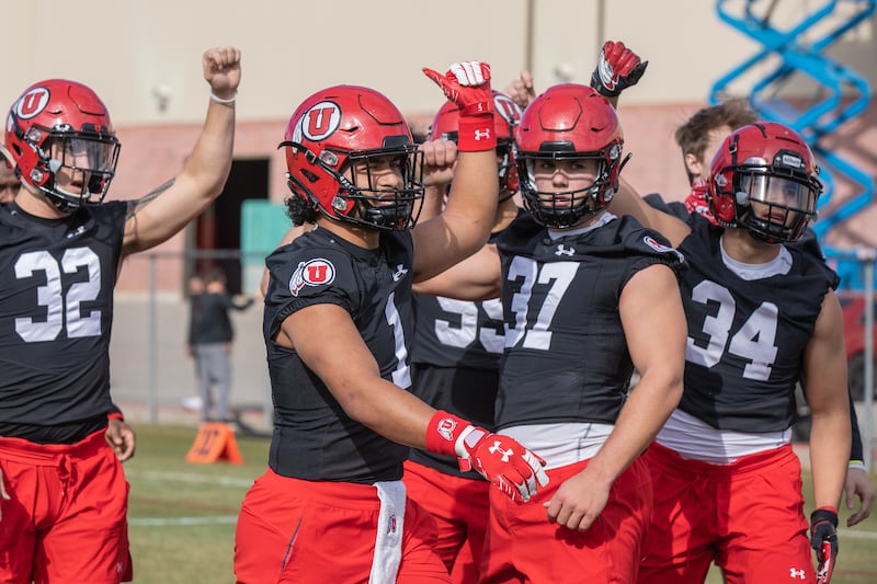Utah freshman linebacker Trey Reynolds (37) signals while standing next to fellow linebacker Nephi Sewell (1) during spring camp at the University of Utah in Salt Lake City.