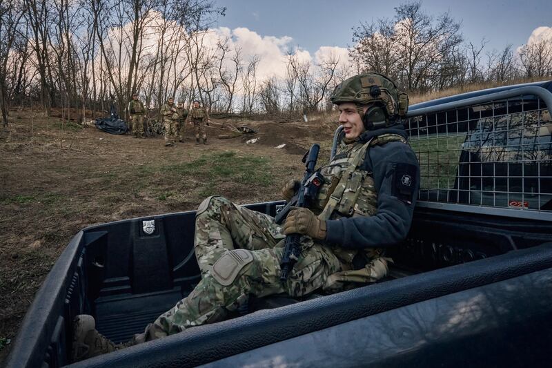 Ukrainian soldiers of the 28th Brigade guard their position close to Bakhmut, Donetsk region, Ukraine, Monday, March 27, 2023.