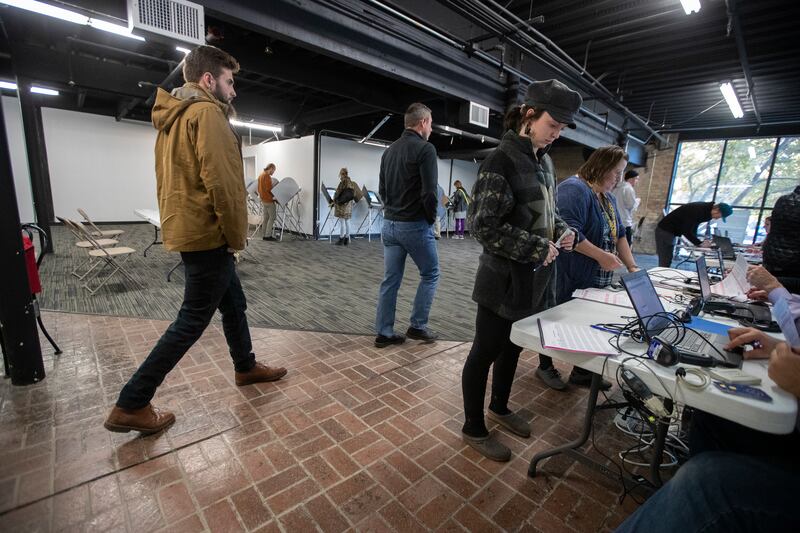 FILE - Voters cast their ballots at a Polling station at Trolley Square in Salt Lake city on Tuesday, Nov. 6, 2018.