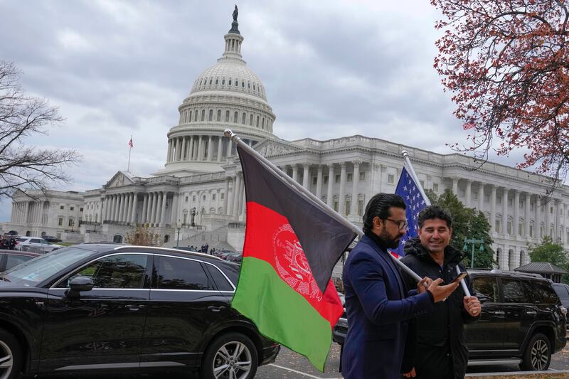 Demonstrators gather outside of the Capital to support new Afghan immigrants on Thursday, Dec. 8, 2022, in Washington.