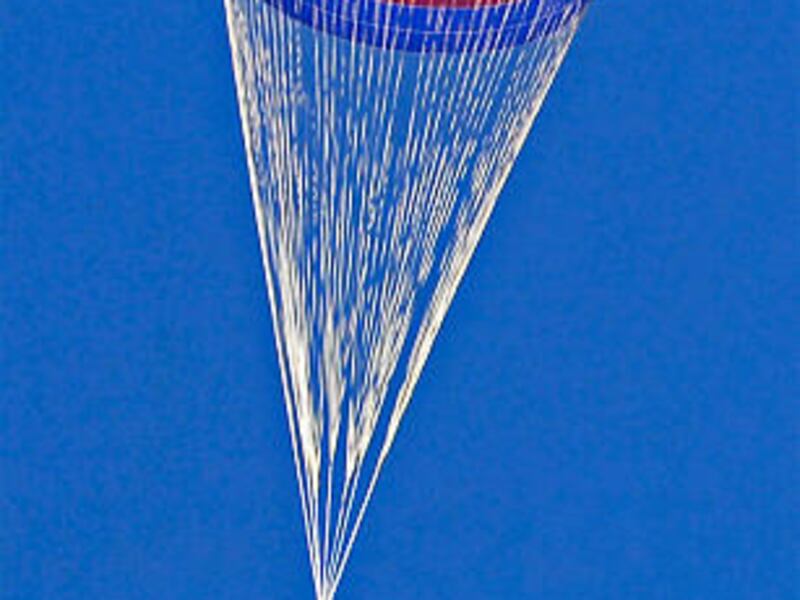 The world's largest parachute floats in the Arizona sky during a test. The parachute is being developed with the help of ATK.