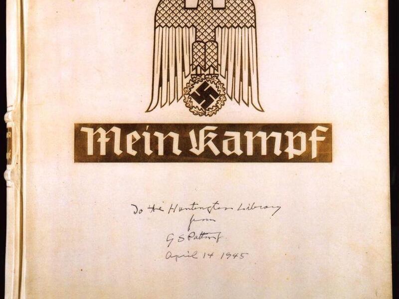File - This is a Huntington Library handout photo showing a copy of the deluxe edition of Adolf Hitler's "Mein Kampf" with the inscription, "To the Huntington Library from G.S. Patton April 14, 1945." Bavarian authorities say they are looking at legal me