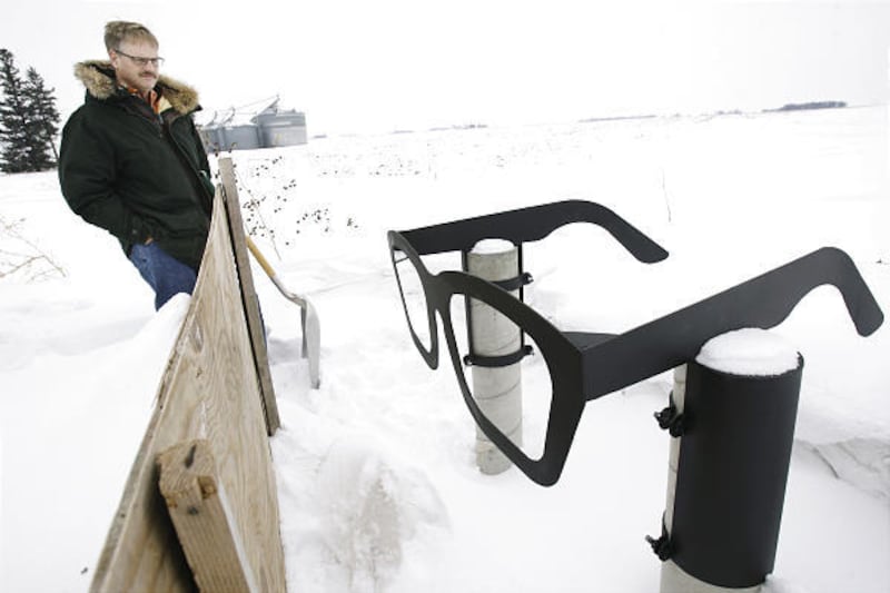 Jeff Nicholas looks at a monument he set up near where Buddy Holly, Ritchie Valens and J.P. Richardson died.