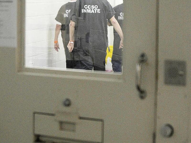 Inmates are seen walking around cell block G at the Cache County Jail pm Dec. 14, 2007. Close to 33 percent of Utah's prison population is made up of people convicted of sex crimes. Inmates in the Cache County Jail are serving time in the sex offender