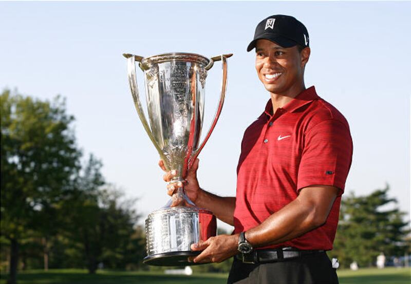 Tiger Woods holds the J.K. Wadley trophy after winning the BMW Championship at Cog Hill Golf & Country Club.