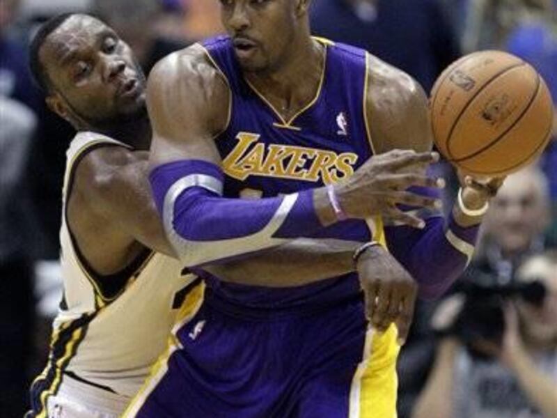 Utah Jazz power forward Paul Millsap (24) knocks the ball from from Los Angeles Lakers center Dwight Howard (12) in the fourth quarter during an NBA basketball game Wednesday, Nov. 7, 2012, in Salt Lake City. The Jazz defeated the Lakers 95-86. (AP Photo/