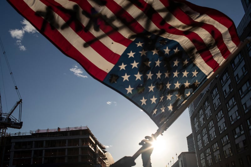 Protesters march down a street during a solidarity rally for George Floyd, Sunday, May 31, 2020, in the Brooklyn borough of New York. Protests were held throughout the city over the death of Floyd, a black man in police custody in Minneapolis who died after being restrained by police officers on Memorial Day.