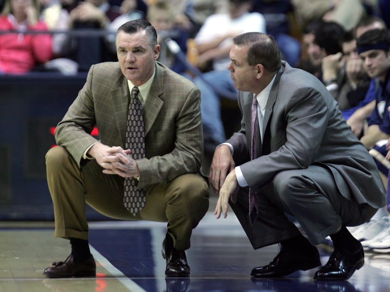BYU coaches Steve Cleveland and Dave Rose converse during game against Colorado State in Provo, Utah Feb. 14, 2005.