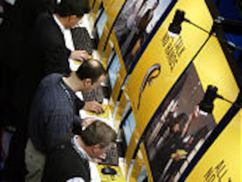 People attending the giant Consumer Electronics Show in Las Vegas line up to check their e-mail. The annual convention draws 110,000 people to Las Vegas.