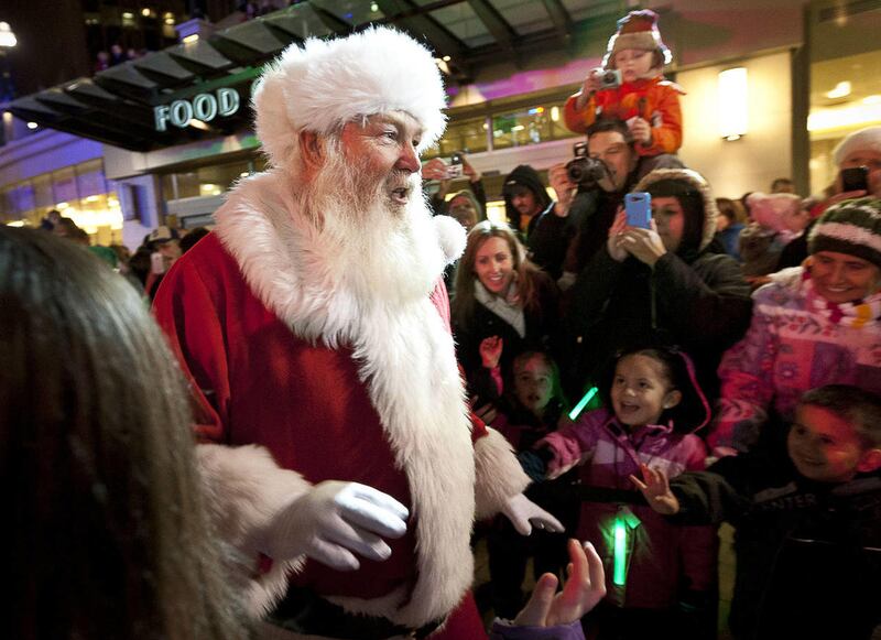 Santa Claus is greeted by his many adoring fans during his entrance at the City Creek Shopping Center holiday celebration, Thursday, Nov. 15, 2012.