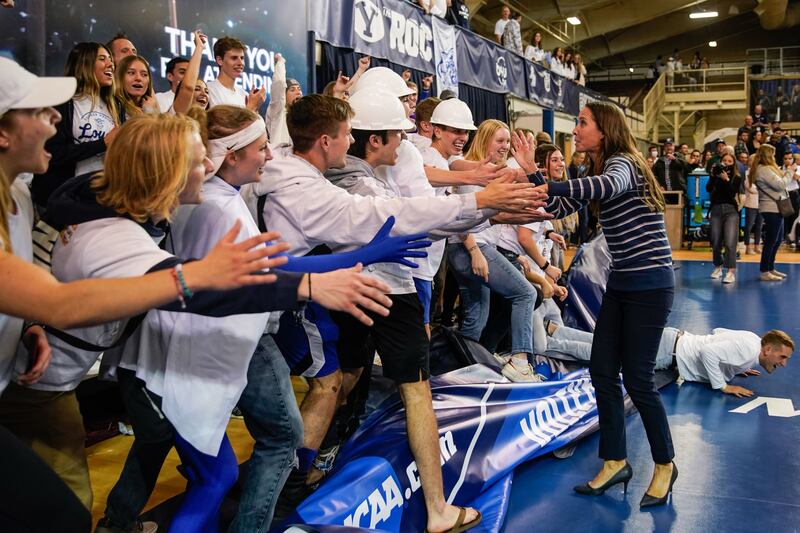 BYU women’s volleyball head coach Heather Olmstead celebrates after winning a game in Provo on Saturday, Dec. 4, 2021.