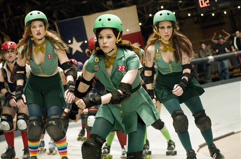 Drew Barrymore, left, Ellen Page and Kristen Wiig star as members of a women's roller derby team in "Whip It."