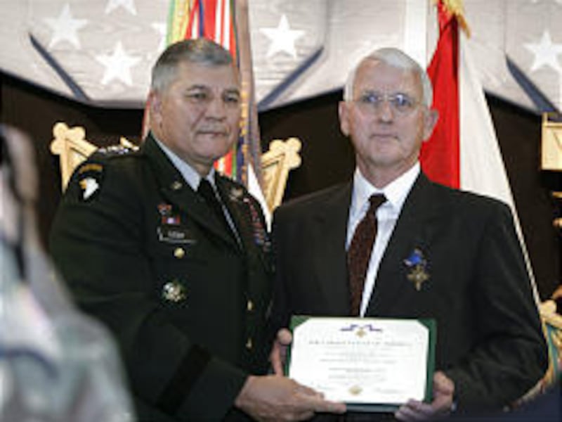 Gen. Richard Cody, left, presents Stephen Lawrence with Distinguished Service Cross. "This is more than I ever expected," Lawrence said.