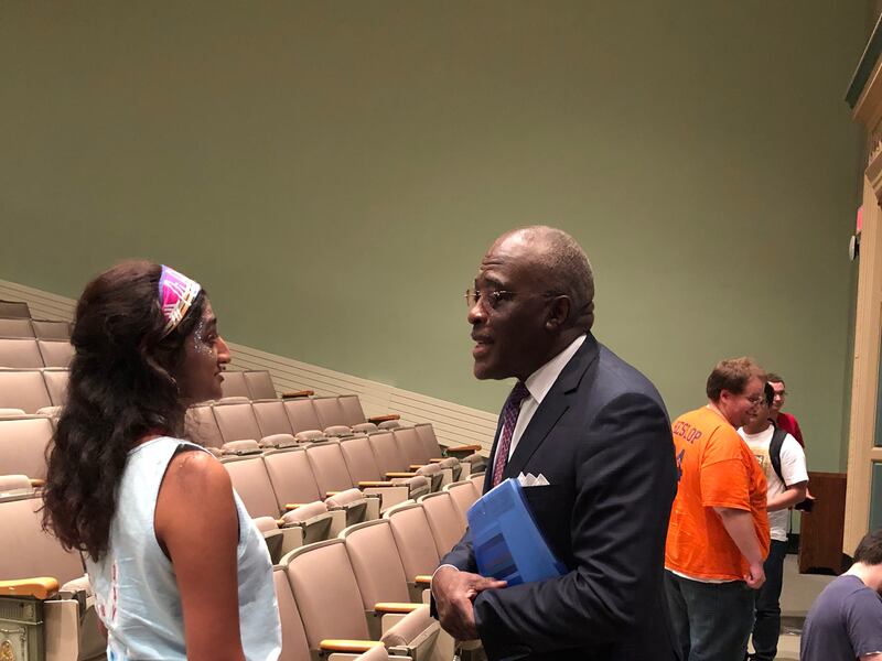 Robert J. Jones, chancellor of the University of Illinois at Urbana-Champaign, speaks with Aishwarya Shekara, a sophomore, after a Sept. 17 event in which participants discussed finding common ground as a more tolerant form of politics.