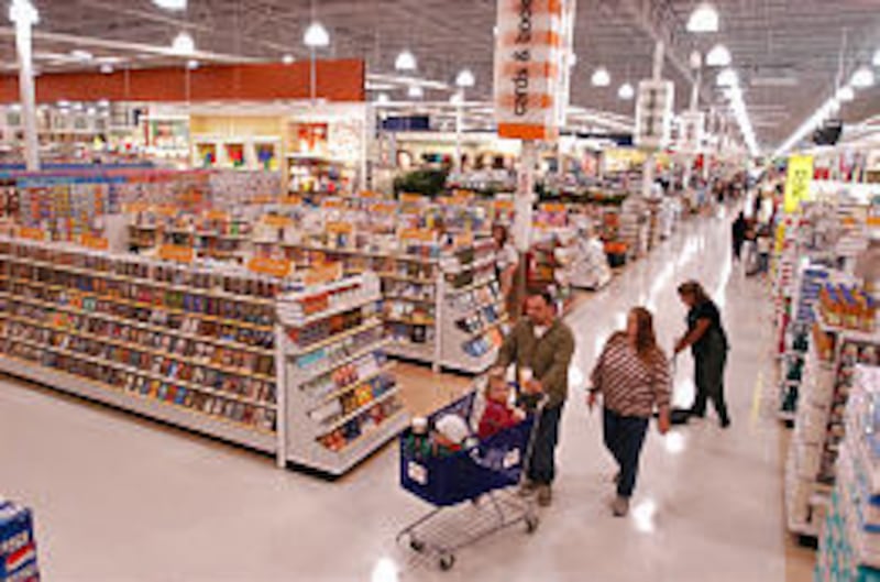 Robert and Natalie Guillory shop with their children, Benjamin and Natalie, at the new Sears Grand in West Jordan Friday.
