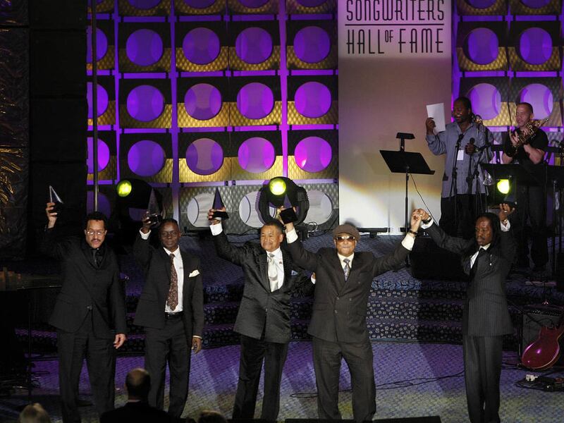 Members of Earth Wind & Fire celebrate on stage after they were inducted into the Songwriters Hall of Fame in New York on June 17, 2010.