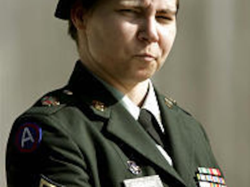 Pfc. Lynndie England leaves courthouse Tuesday after she apologized for abusing Iraqi prisoners.