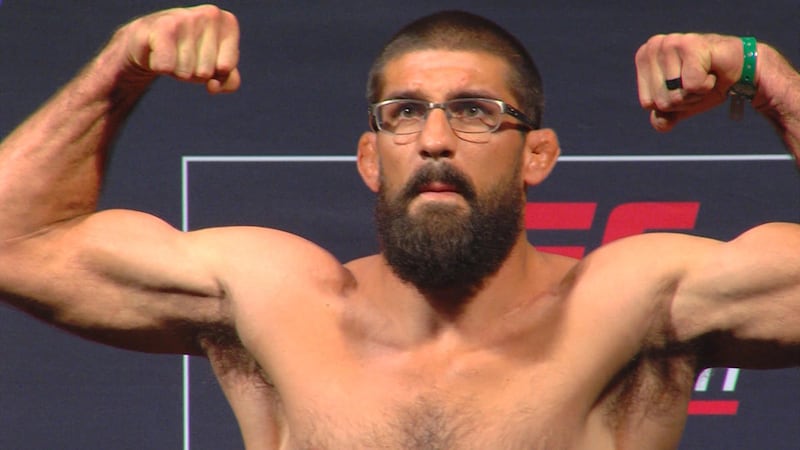 UFC fighter Court McGee flexes after weighing in for UFC Fight Night in Salt Lake City, Friday, Aug. 5, 2016 at Vivint Arena.