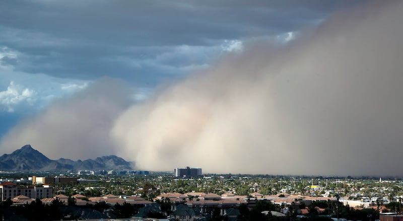 In this July 21, 2012, file photo, a large dust storm, or haboob, sweeps across downtown Phoenix.