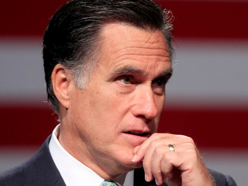 FILE - In this May 8, 2012 file photo, Republican presidential candidate, former Massachusetts Gov. Mitt Romney speaks in Lansing, Mich. Obama’s popularity among women, minorities and independents is giving him an early edge over his likely GOP rival, Mitt Romney, according to a new AP-GfK poll. But Americans are split over which candidate can best handle the economy, which might open pathways for Romney. (AP Photo/Carlos Osorio, File)