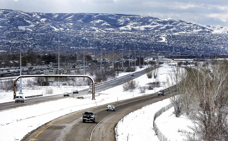 Vehicles travel on Legacy Parkway in Farmington on Monday, March 6, 2017.