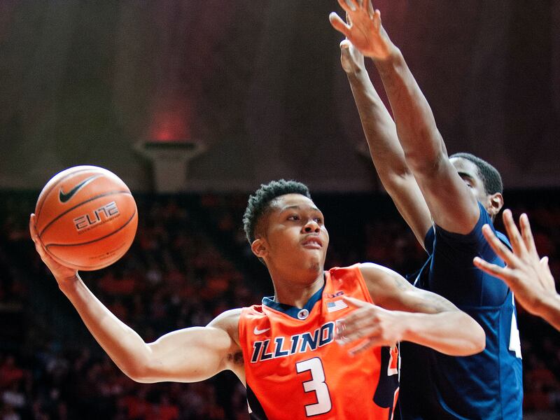 Former Illinois guard Te’Jon Lucas looks to pass the basketball in a February 2017 game. Lucas, who most recently played at Milwaukee, is transferring to BYU.