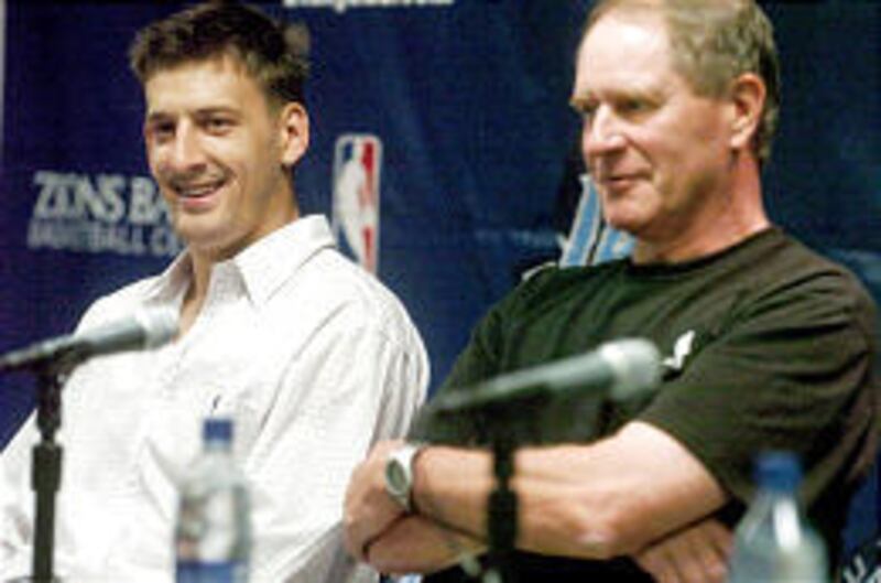 Utah Jazz guard Gordan Giricek, left, and team senior vice president for basketball operations Kevin O'Connor talk to media after Giricek signed a four-year, $16 million contract.