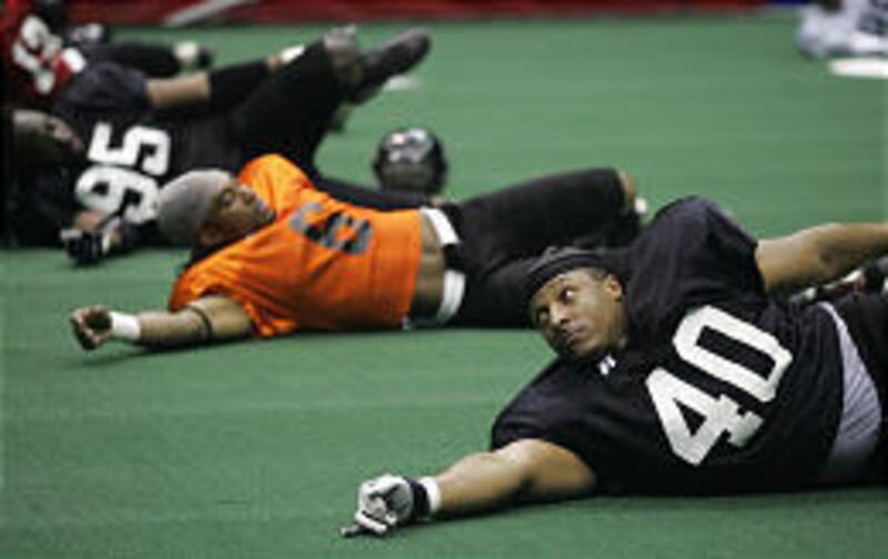 The Blaze's biggest offseason acquisition, Frank Carter, (40) stretches at Blaze practice.