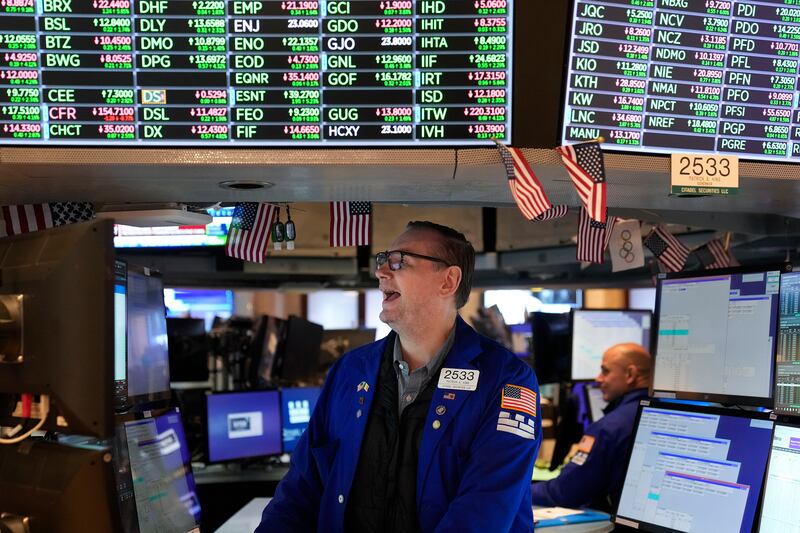 Traders work on the floor at the New York Stock Exchange in New York, Thursday, Nov. 10, 2022.