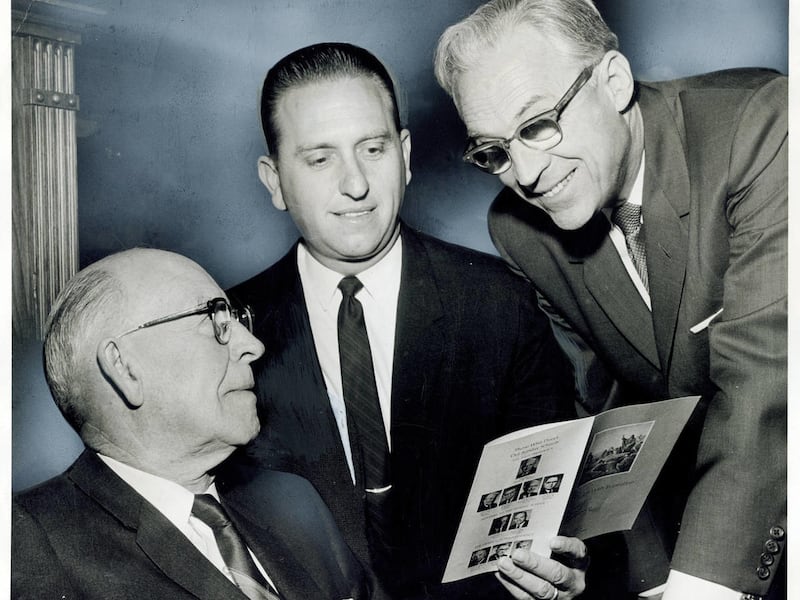 Elder LeGrand RIchards, left, Elder Thomas S. Monson and David Lawrence McKay go over a program of Sunday School session in the Tabernacle which featured talks and a dramatization. April 8, 1968