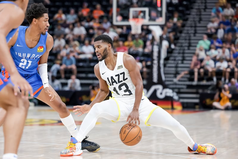 Utah Jazz guard Jared Butler drives against Oklahoma City Thunder guard Aaron Wiggins during a Summer League game at Vivint Arena in Salt Lake City on Tuesday, July 5, 2022.