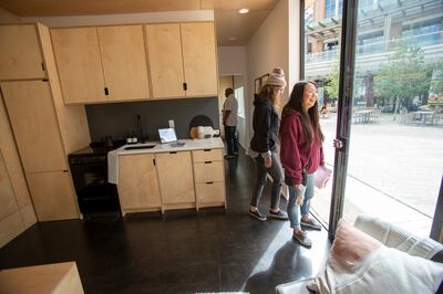 Adriana Wright and Tonya Wilson and others tour a Modal Living home at City Creek Center in Salt Lake City on Monday, May 20, 2019.