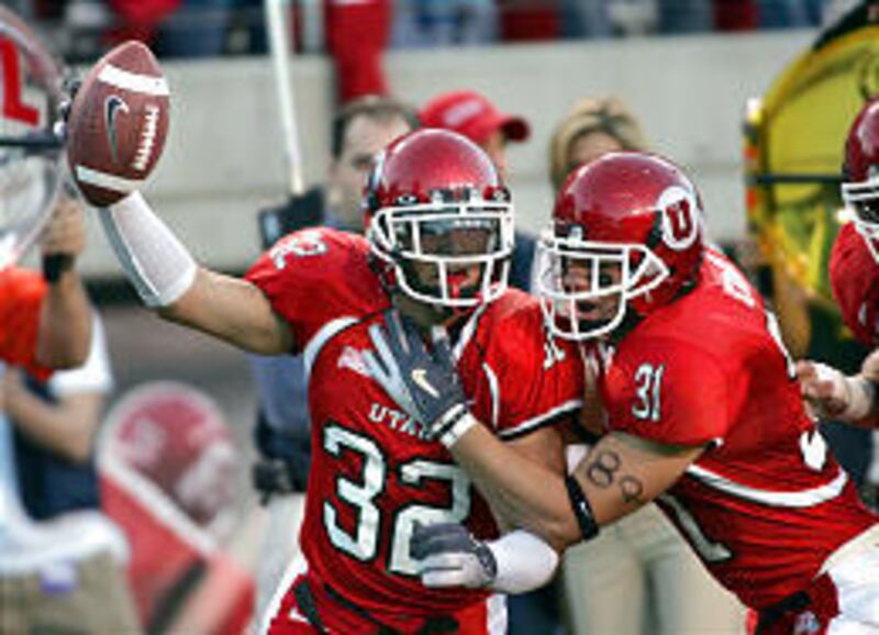 Utah defensive back Eric Weddle, left, and Casey Evans celebrate after Weddle recovered a fumble that led to a Utah touchdown earlier in the year against Air Force.