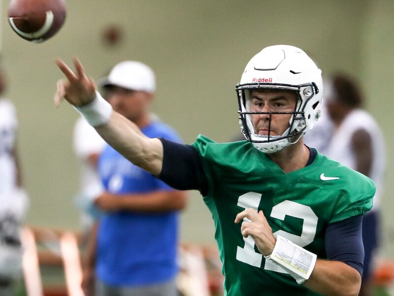 BYU quarterback Tanner Mangum fires a pass during football practice in Provo on Friday, Aug. 3, 2018.