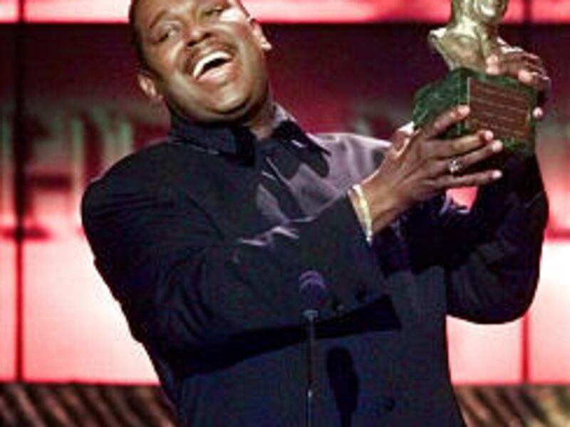 Luther Vandross accepts the Quincy Jones Award for Outstanding Career Achievements at the 13th annual Soul Train Music Awards, in this March 26, 1999 file photo, in Los Angeles. Vandross died Friday.