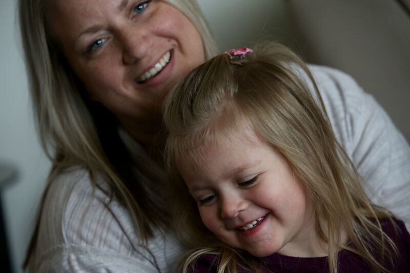 Katie Monger and her daughter, Charlie, are photographed in their home in West Valley City on Friday, Feb. 8, 2019. Monger, a CHG employee, used the company's Employee Compassion Fund to help pay bills after her husband, Troy, died.