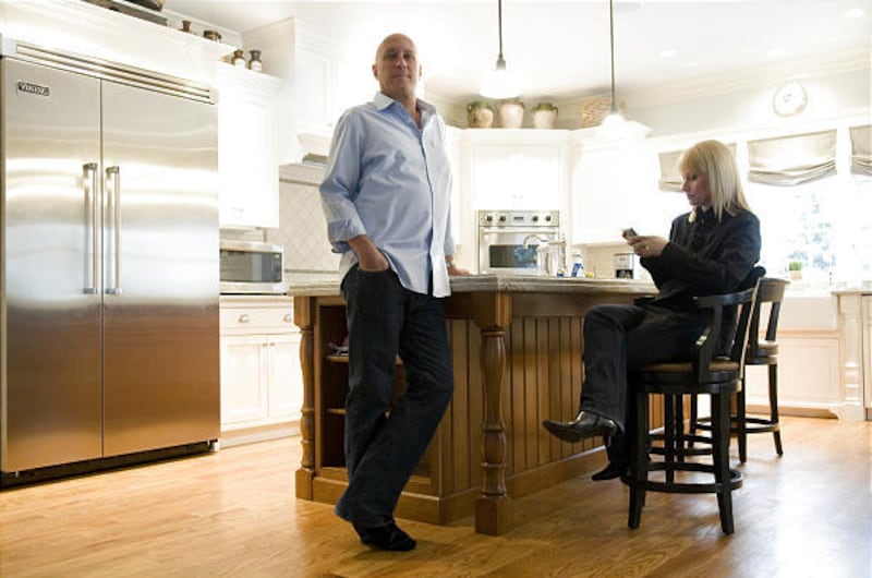 Steve Wilkos, left, and his wife Rachelle Wilkos pose for portrait inside the kitchen of their Darien, Connecticut home.