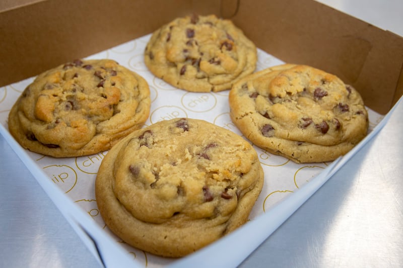 Chip Cookies owner Sarah Wilson puts a few cookies in a box at the company’s Salt Lake City location on Monday, March 25, 2019.