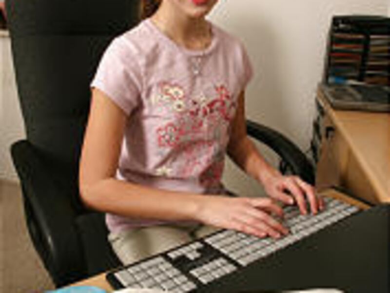 Kaisa Goodman practices her keystrokes. She broke a record by typing 137 words per minute.