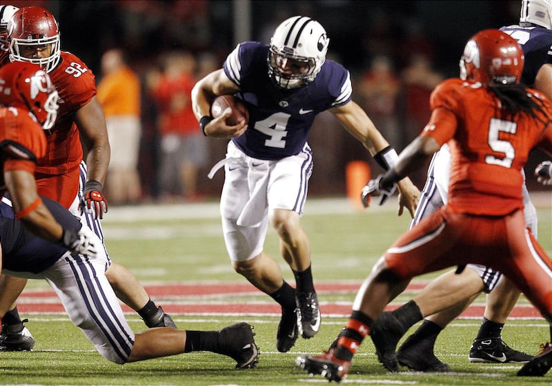 Brigham Young Cougars quarterback Taysom Hill (4) runs up the middle in Salt Lake City Sunday, Sept. 16, 2012.